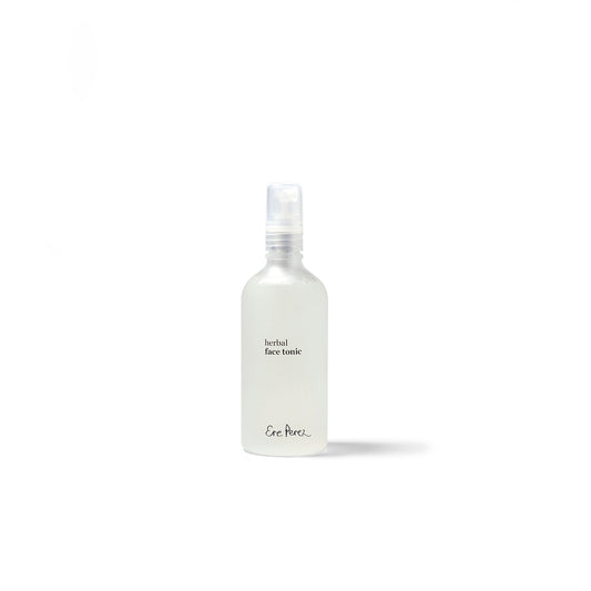 vista frontal de envase sostenible de vidrio transparente con letras en color negro del tonico facial herbal ere perez en fondo blanco disponible en blumma