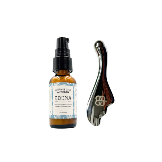 vista frontal de envase de vidrio color ambar del suero de ojos antiedad junto con roller para masajes edena en fondo blanco